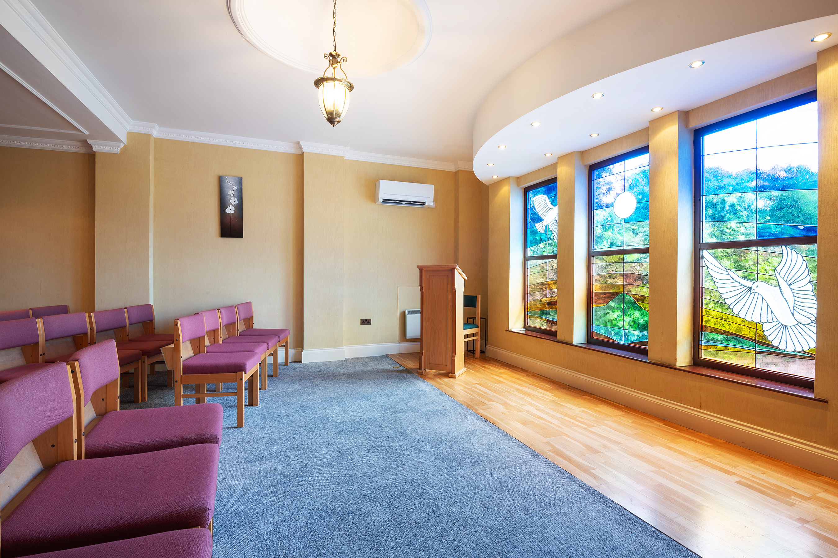 Funeral service venue with stained glass window