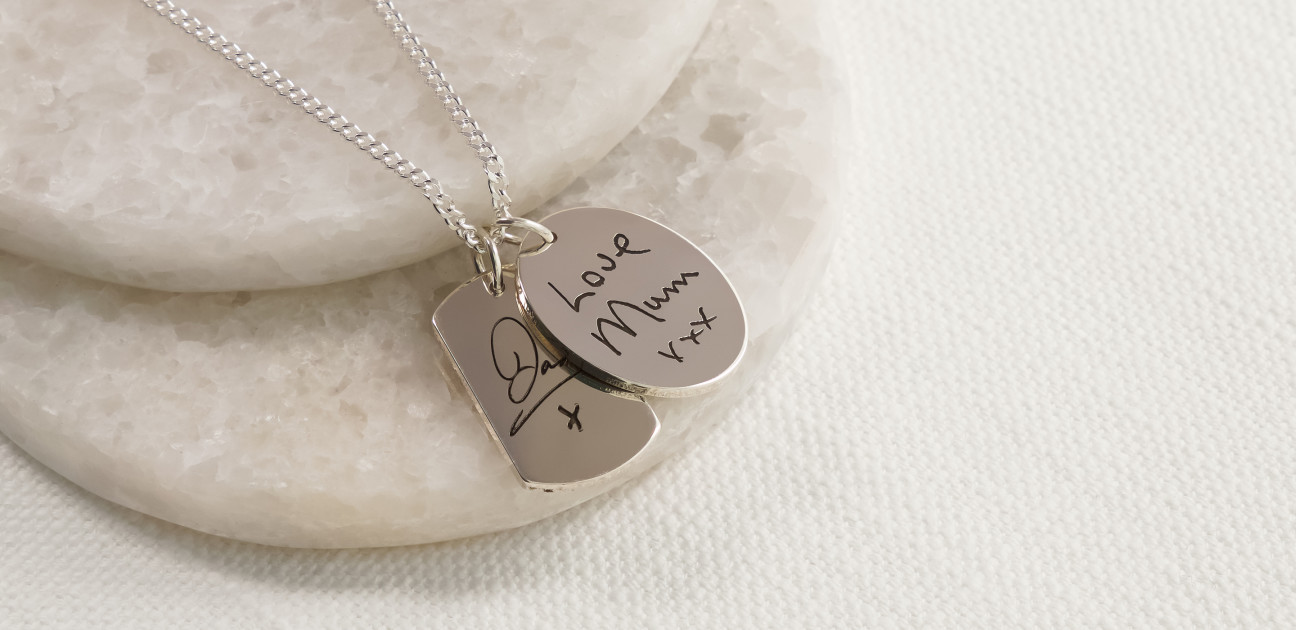 Silver pendant with handwriting inscription