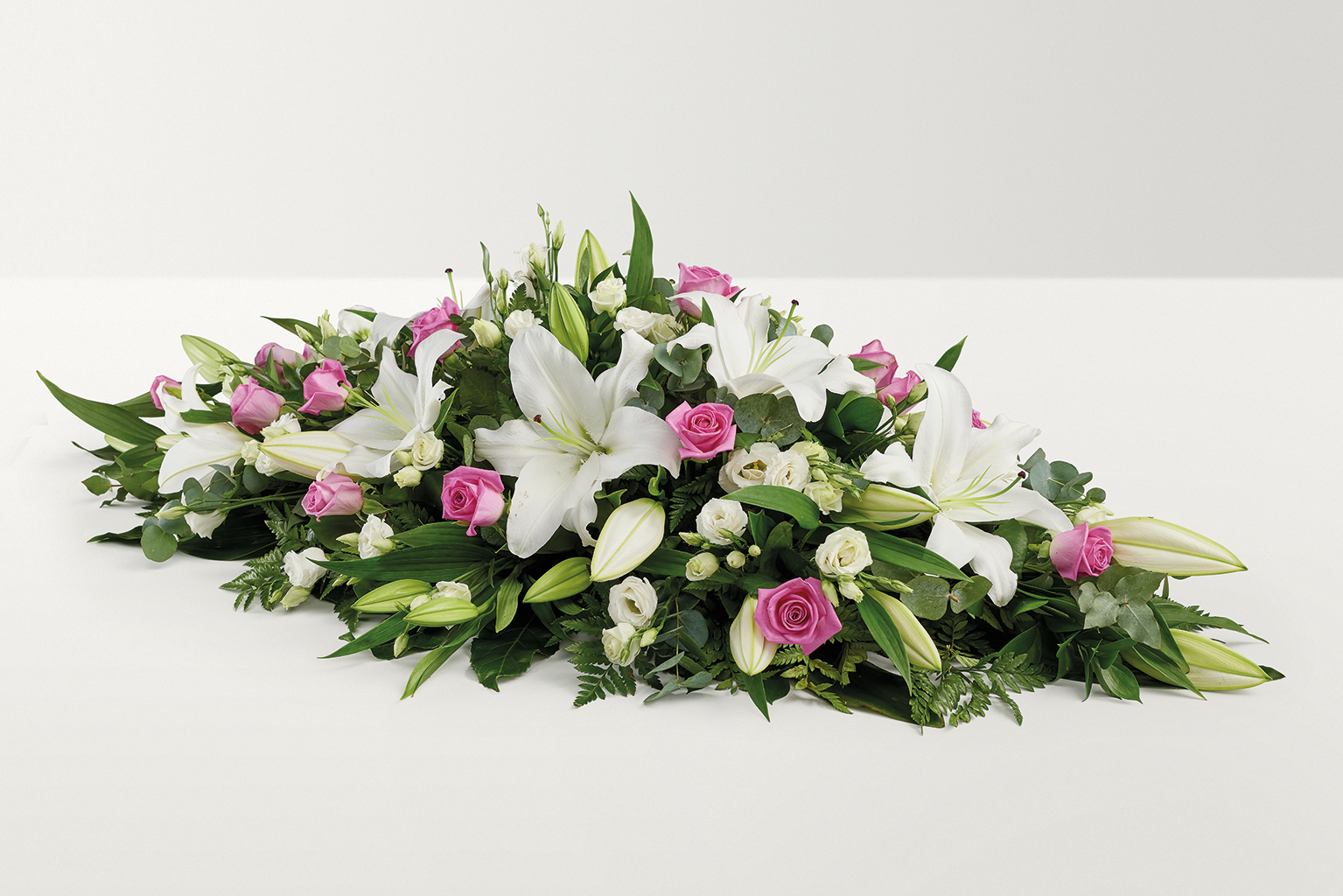 Pink and white rose and lily floral display