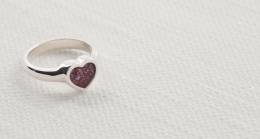 Silver ring with heart shaped mount and red glass centre