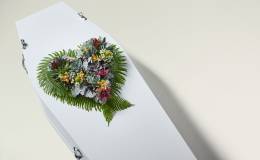 Image of Botanical Heart arrangement on top of a coffin