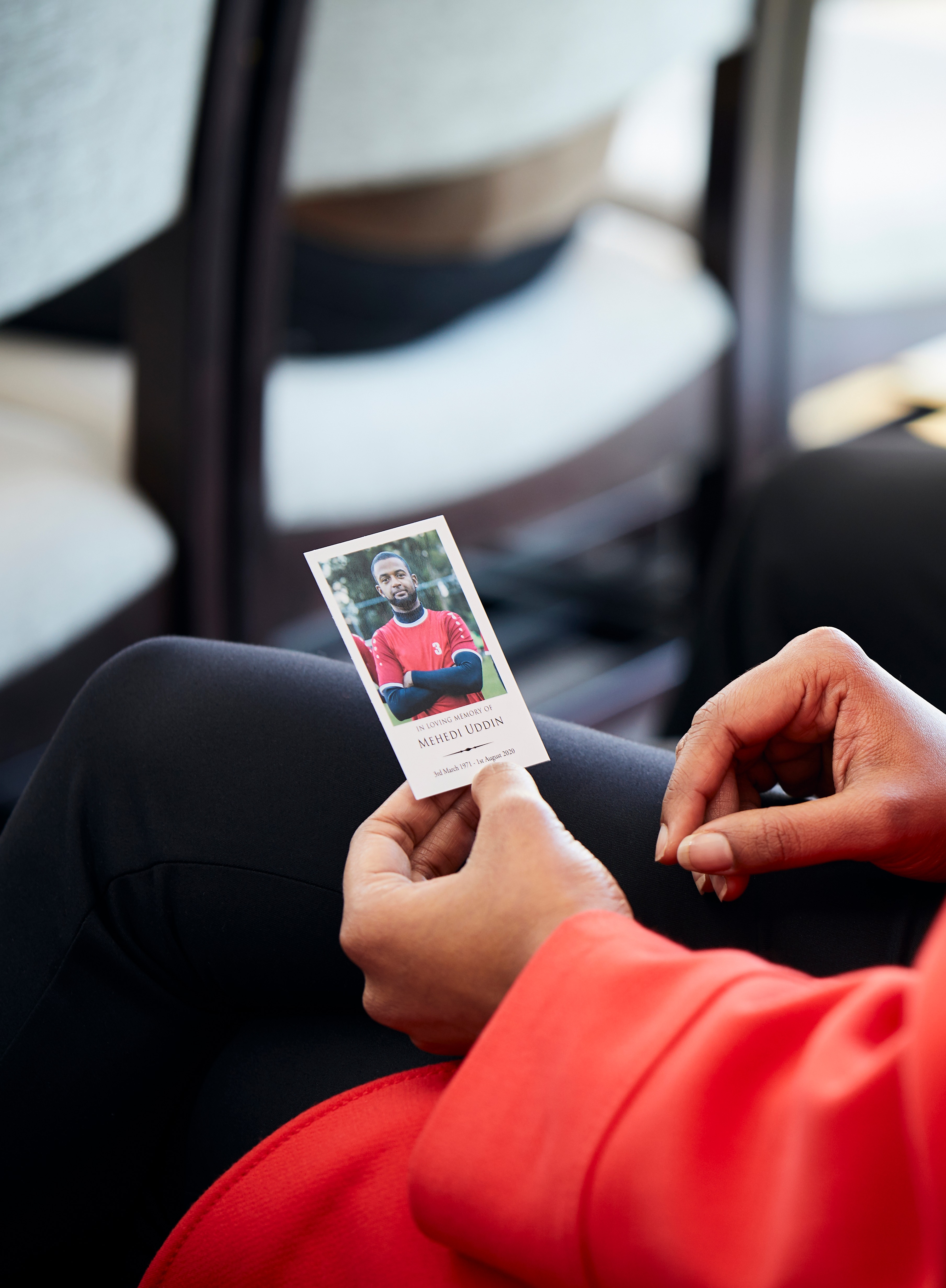 Memorial Card being held at a funeral service