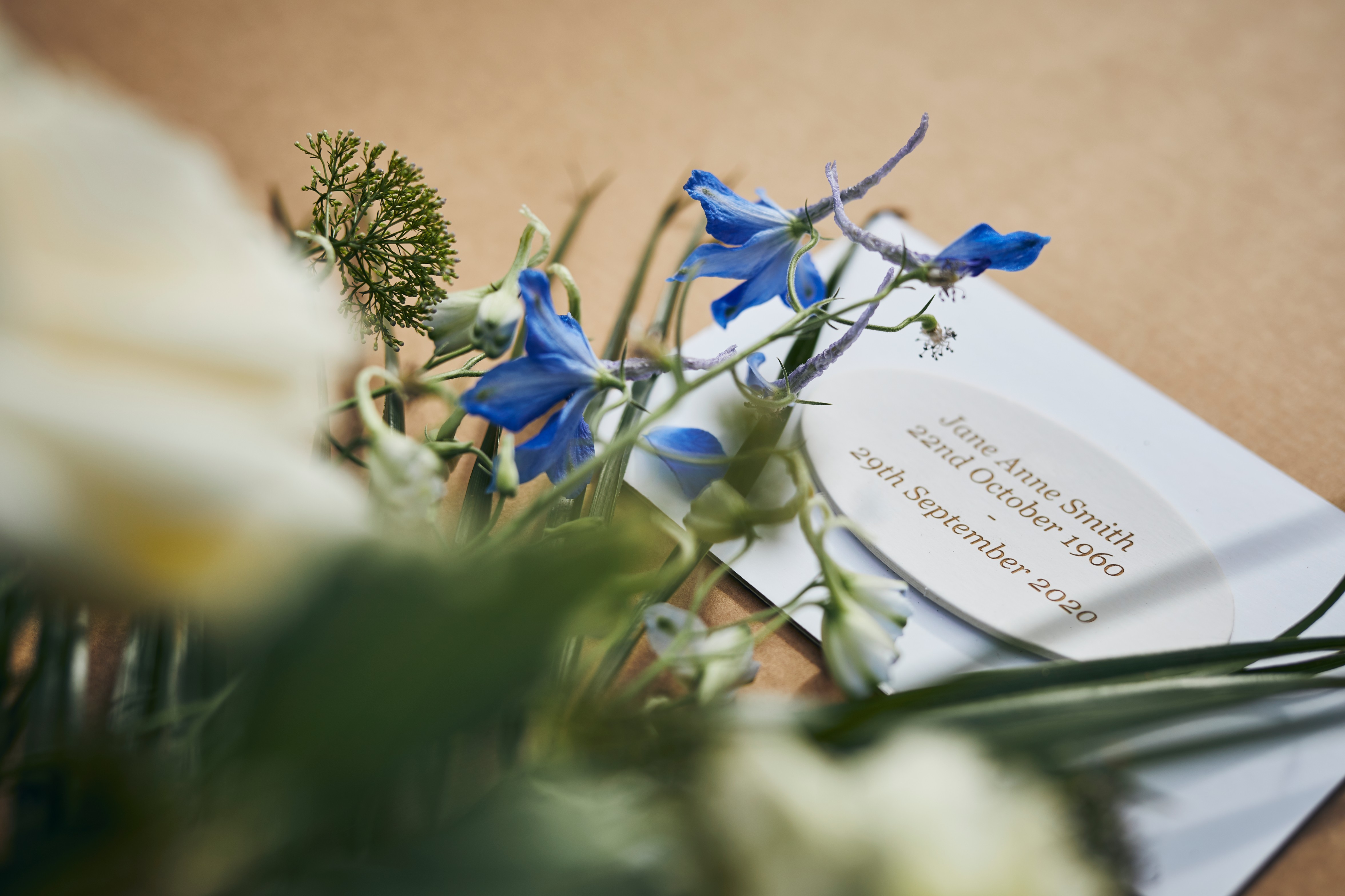 Memorial message written on a card for flowers