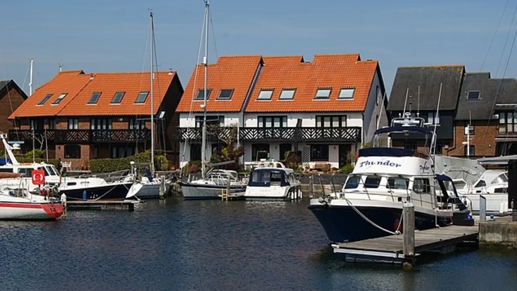 Boats docked at a harbour.