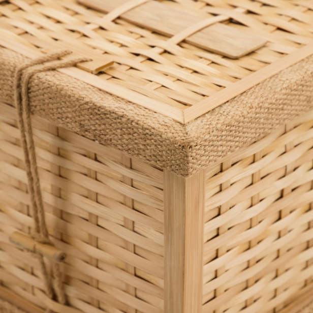 Close up of the corner of the woven bamboo coffin with string toggle fastenings