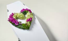 Orchid and hydrangea heart on coffin