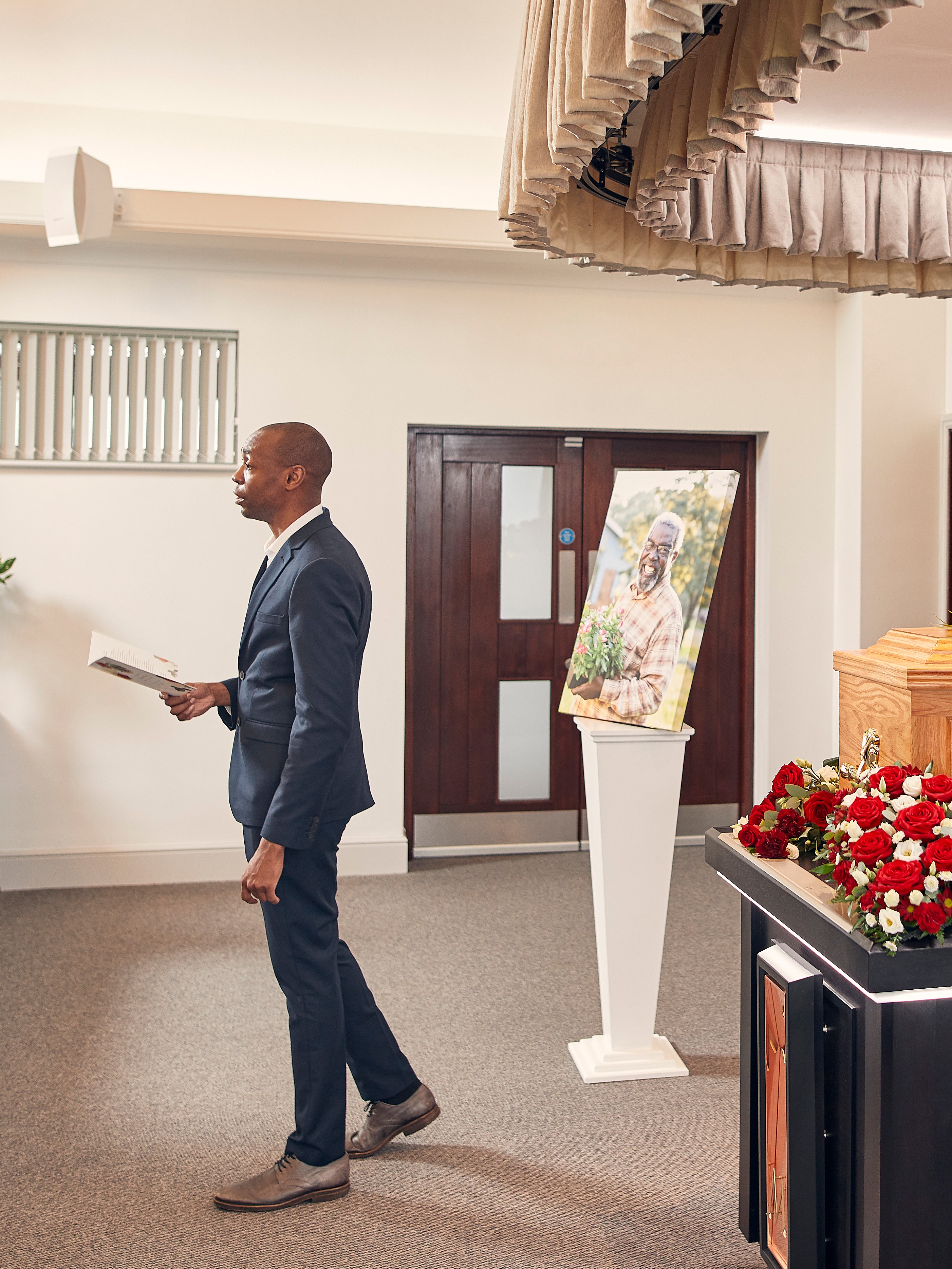 Canvas next to a coffin at a funeral