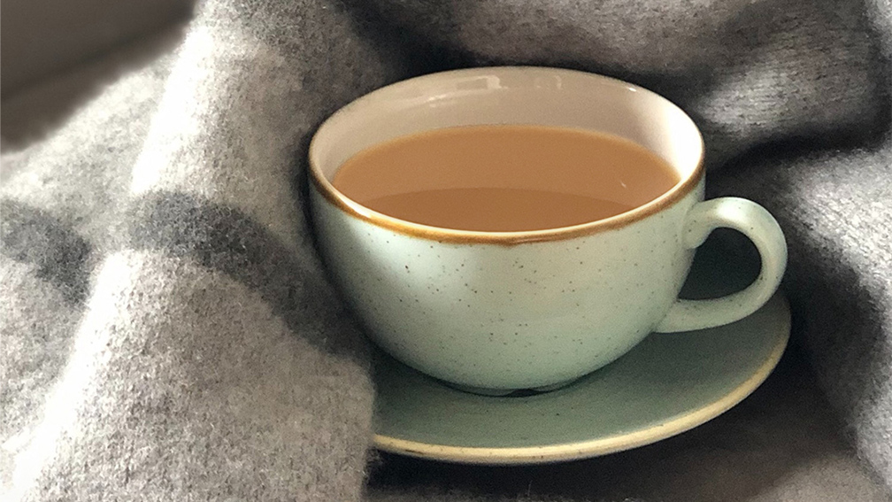 Cup of tea with a blanket