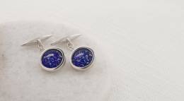 Silver cufflinks with blue glass centres
