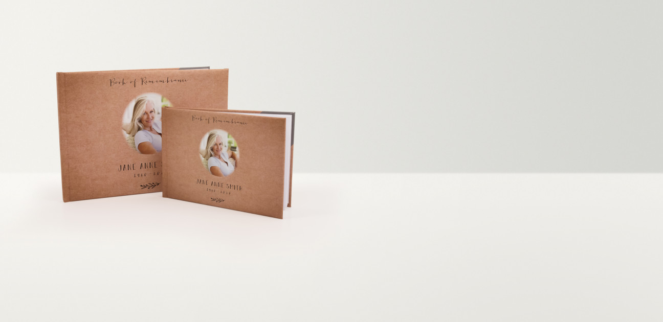 Brown rectangular books of remembrance in two sizes with photographs and text