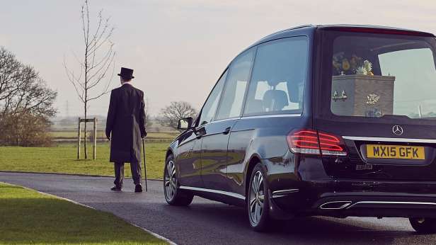 Funeral director and hearse