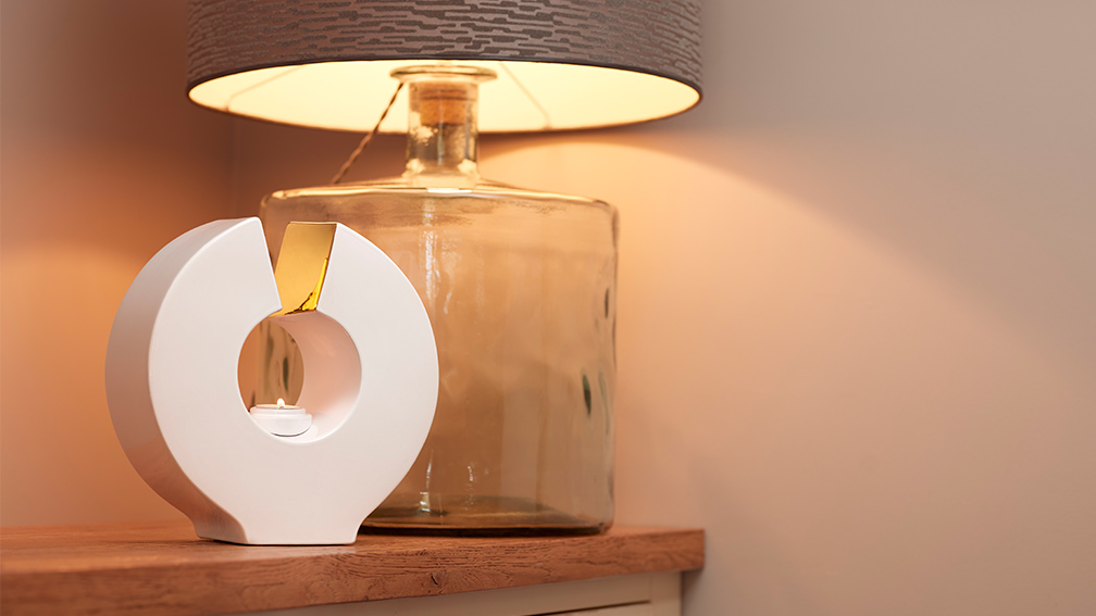 White candle urn on a table