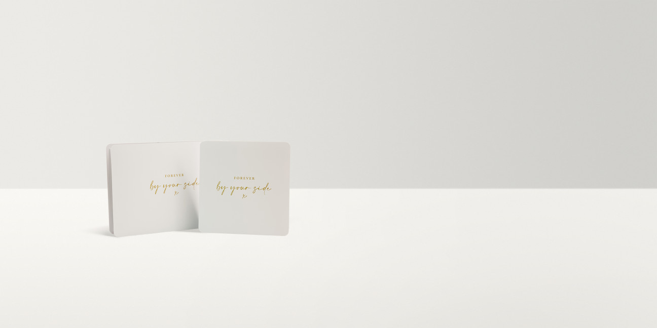 Two white rectangles with gold calligraphy