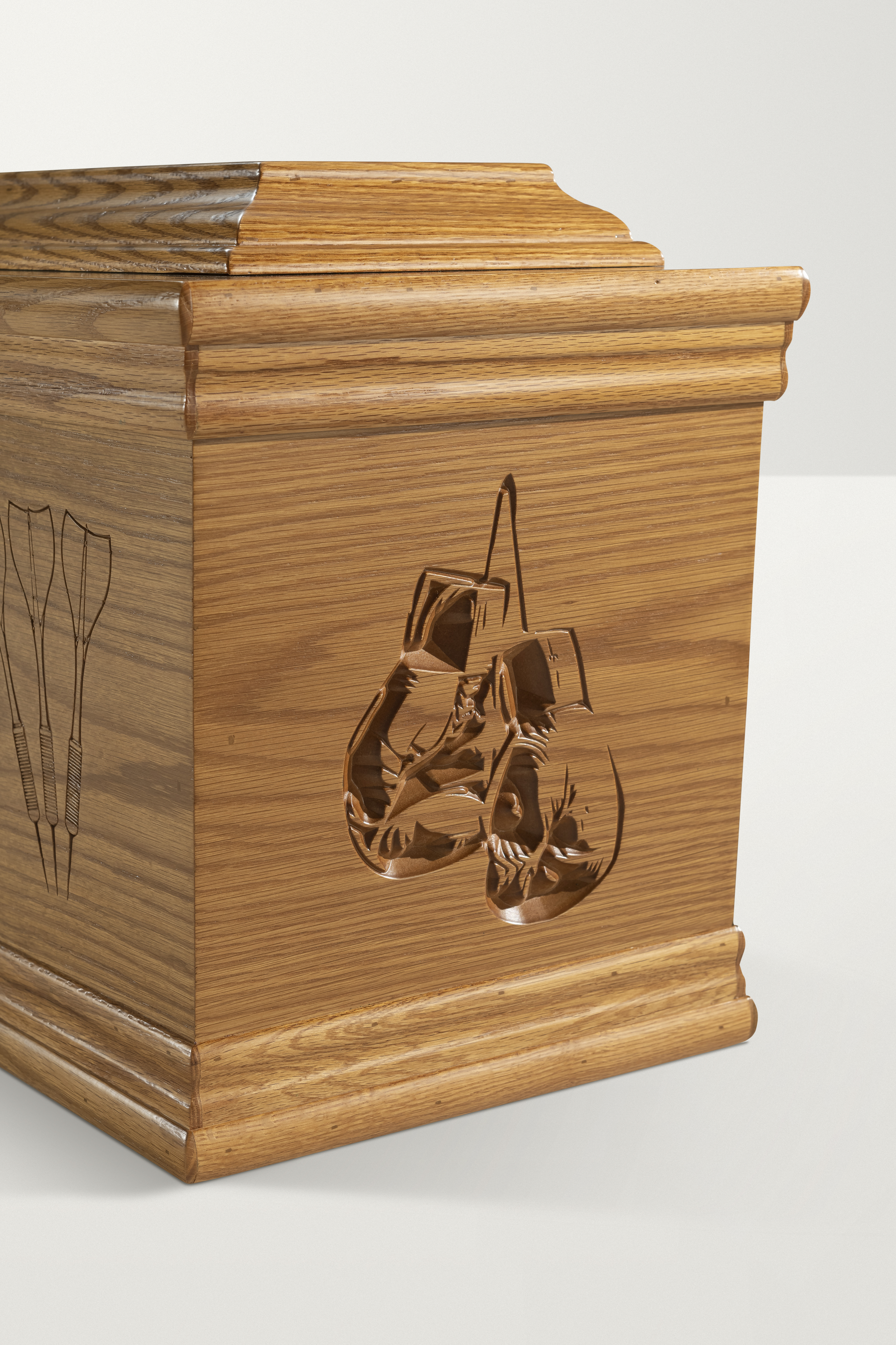 Detail of boxing glove engraving on Oak Artiste coffin