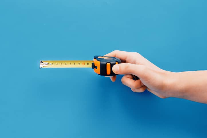 Person holding a tape measure