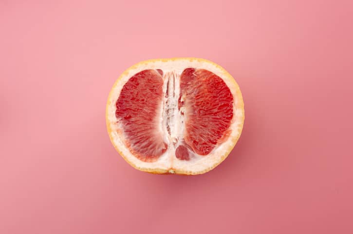 Pink grapefruit representing a vagina 