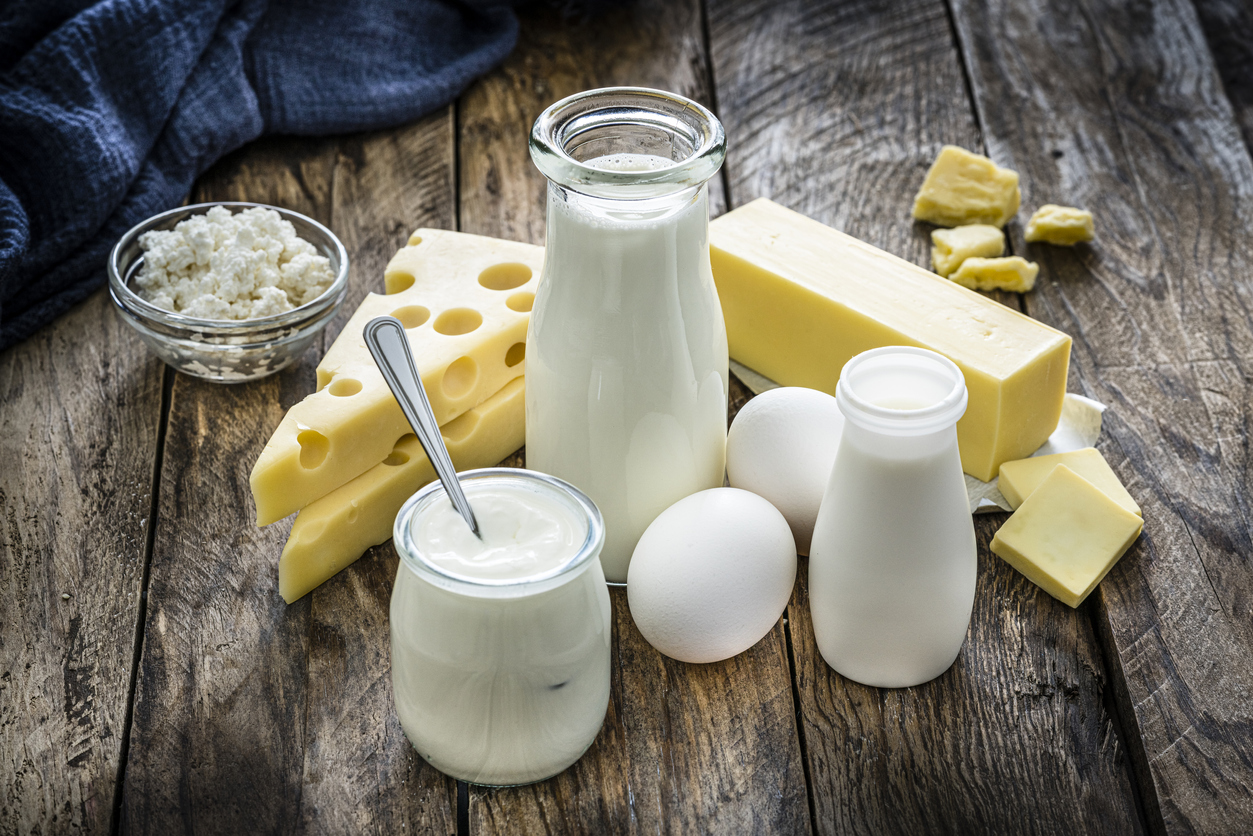 High angle view of most common dairy products shot on rustic wooden table (Credit: fcafotodigital)