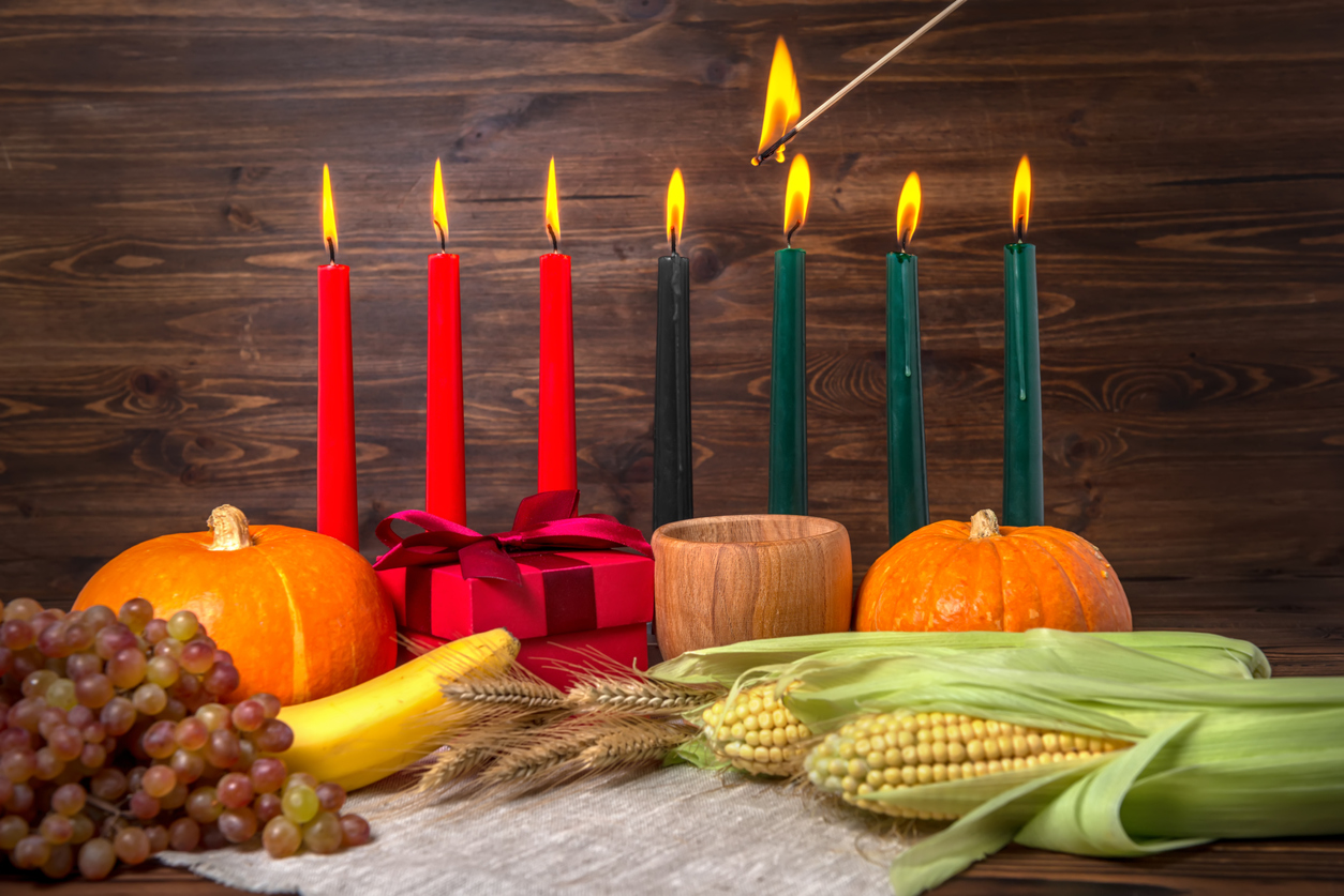 Lighting Kwanzaa traditional candles during the holiday celebrations (credit - a_lis)