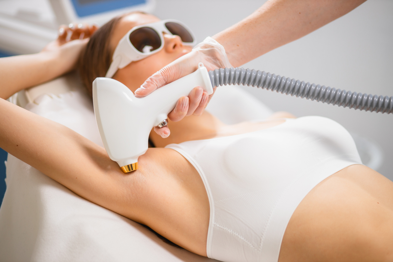 Woman having a laser hair removal treatment