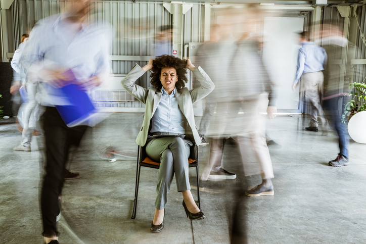 Woman Pulling Her Hair While Being Surrounded By Her Colleagues Who Are 4968