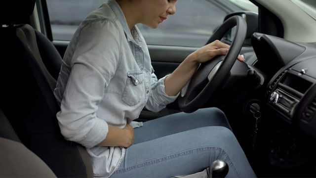 Woman driving with incontinence