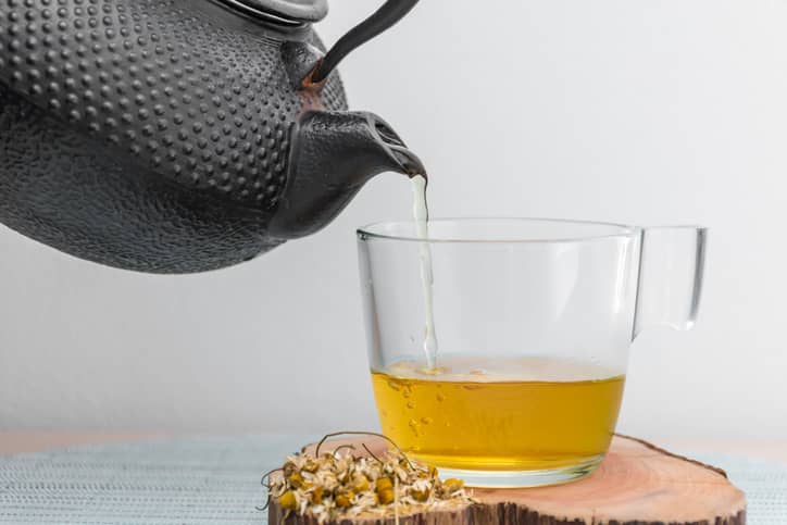 Camomile tea being poured