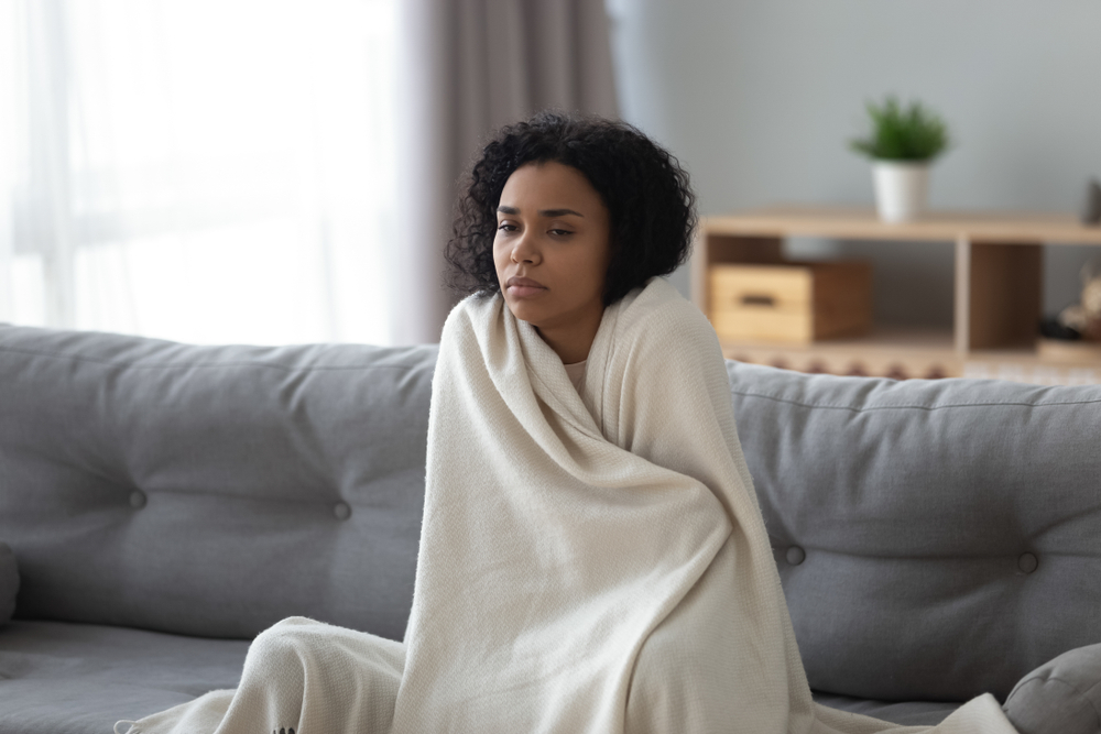 young woman feeling ill with temperature
