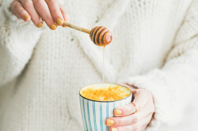 A cup of warm milk with honey and cinnamon to help you relax before falling asleep