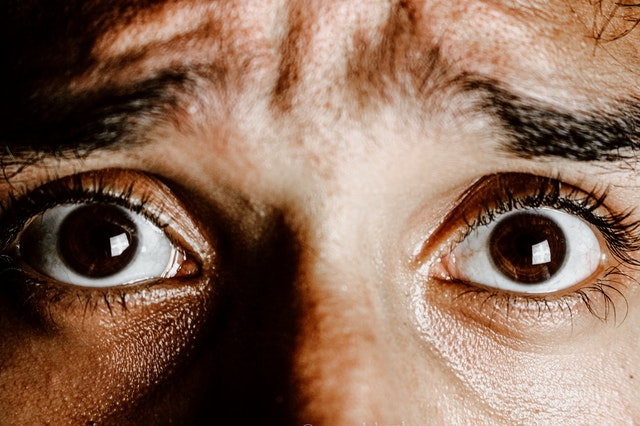 Close up of man's eyes looking scared