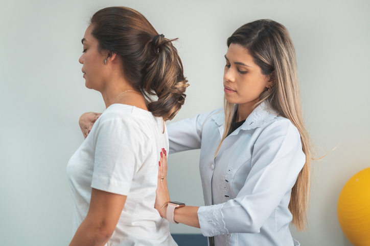 Woman having treatment for posture or back pain
