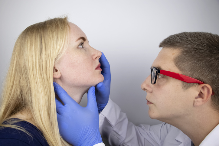 Doctor examines a patient's nasal passages