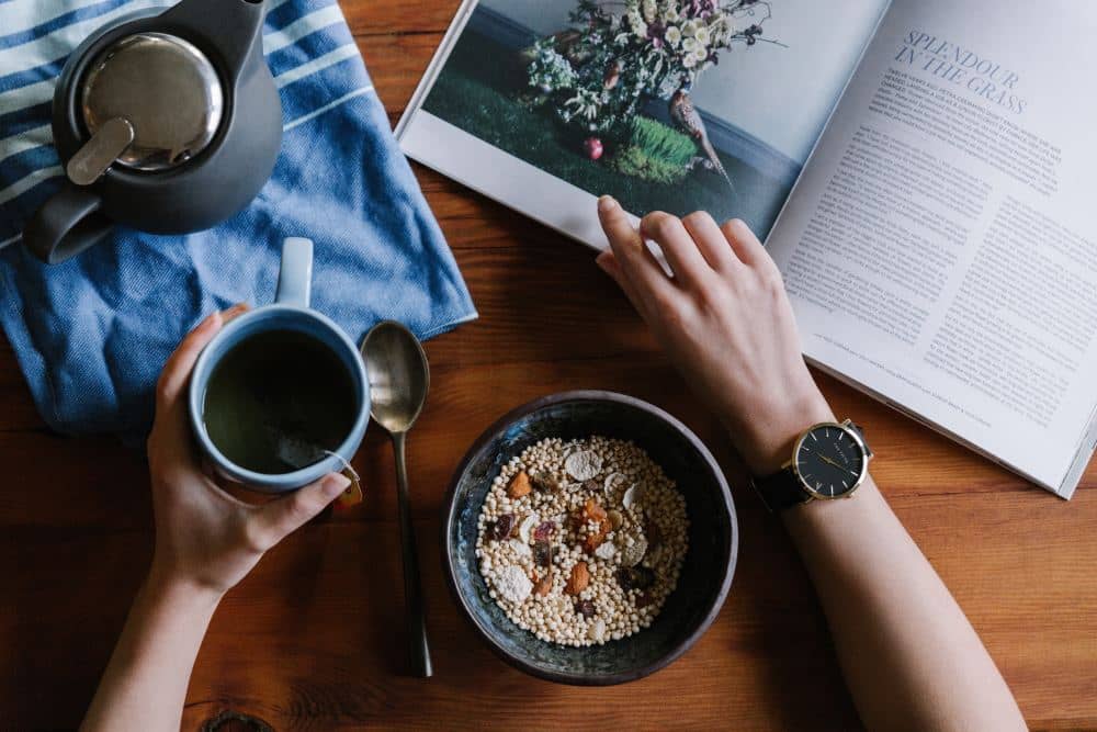 images self-care-for-depression-how-can-it-help person-with-cereal-tea-and-book