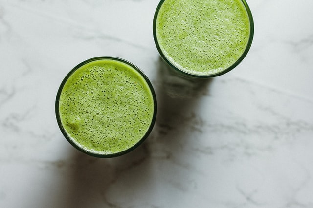 Two glasses of green juice recommended by the SirtFood Diet