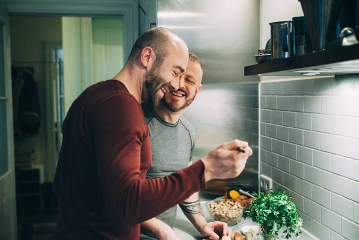 Couple preparing meal in the kitchen together