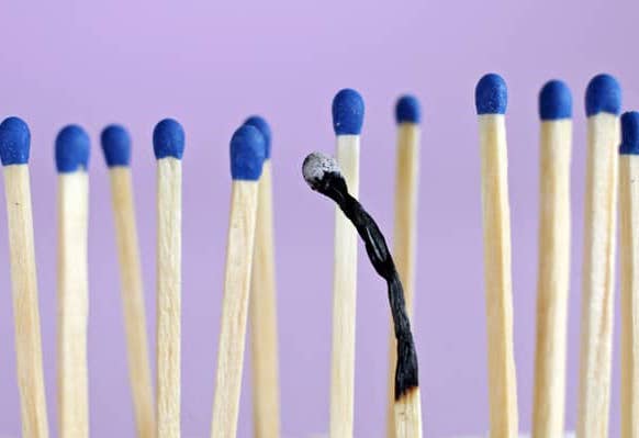 A row of matches with one burnt out