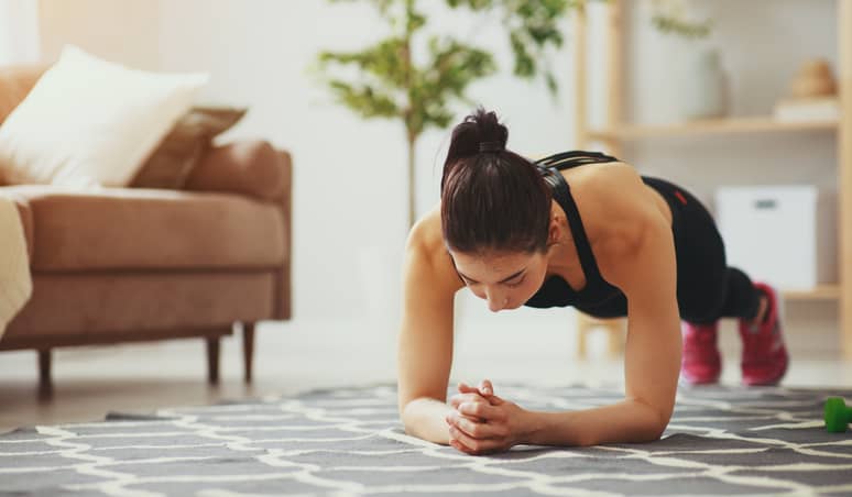 Person doing the plank exercise at home