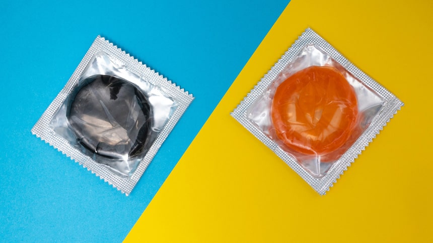 Two condoms on a blue-yellow background- Photo by Reproductive Health Supplies Coalition on Unsplash