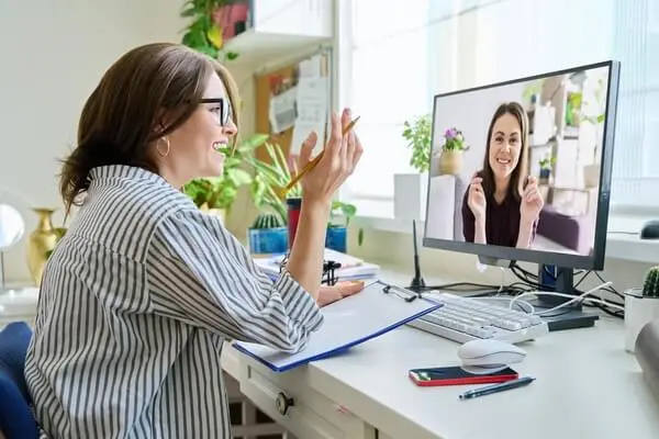 Woman talking with a young woman online