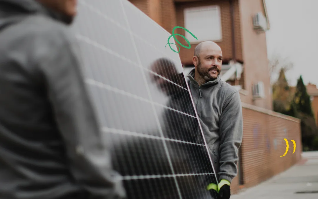 Solar panels being carried by two installers