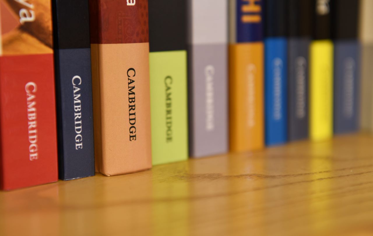 a bookshelf of higher education textbooks
