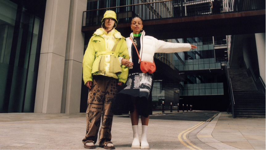 Two people modelling clothes on street