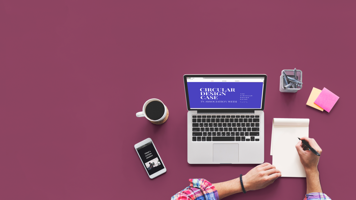 person with a laptop and notepad