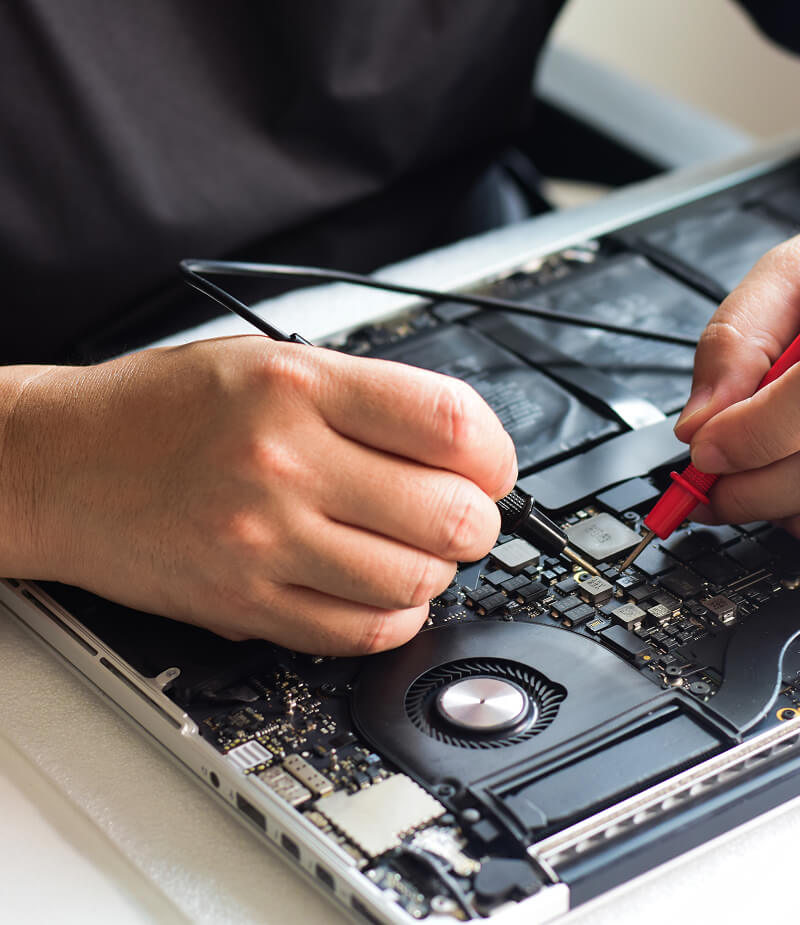 A person repairing a laptop