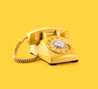 Yellow telephone on yellow background