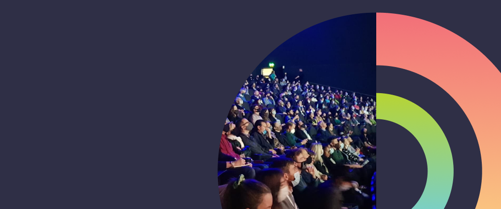 Audience of people with abstract circles