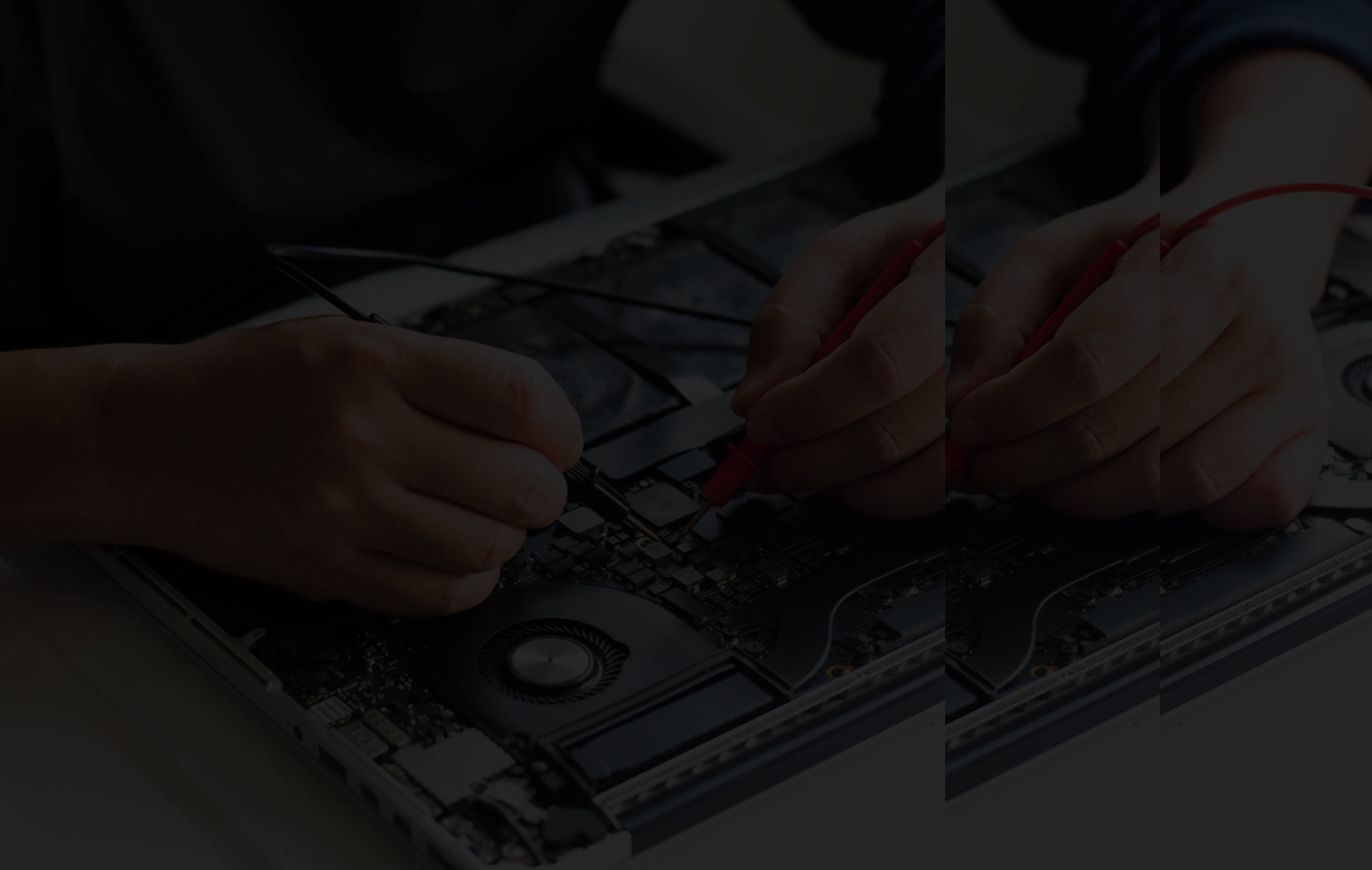 A person repairing a laptop