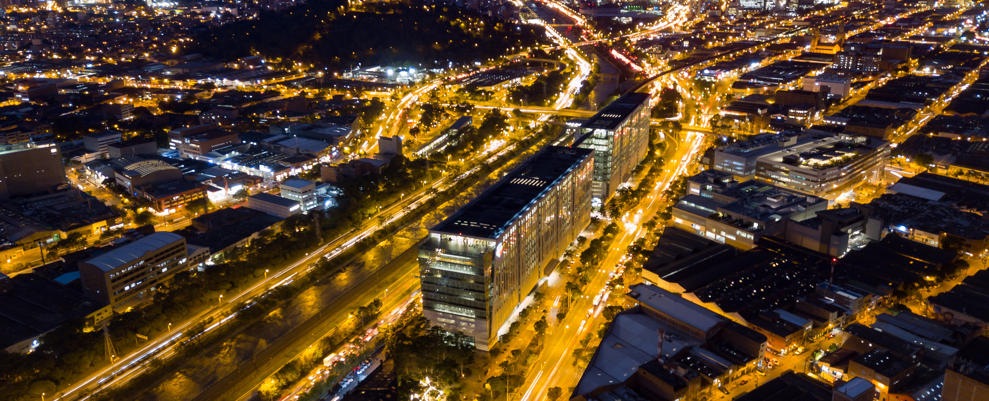 An image of the Bancolombia Building at night. 
