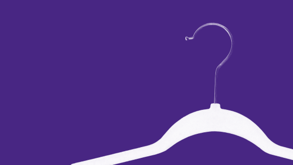 Clothes hanger on purple background