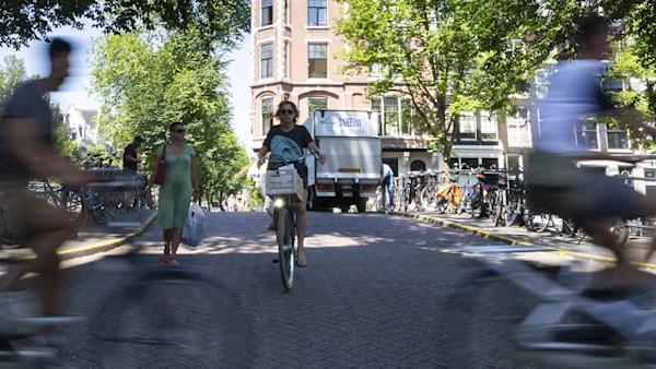 Photo of people riding bicycles