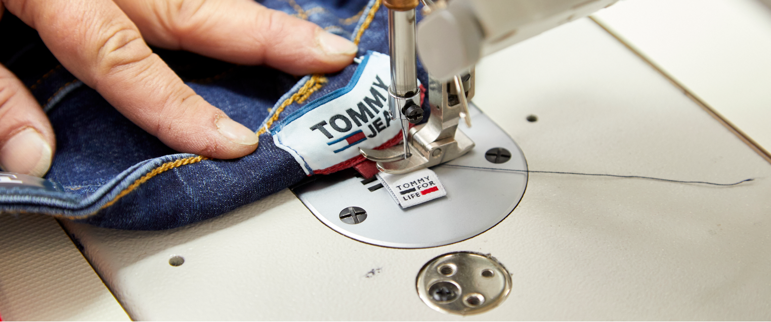 Person sewing jeans